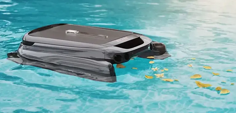 Aiper robotic pool cleaner working in an inground pool, efficiently removing debris.