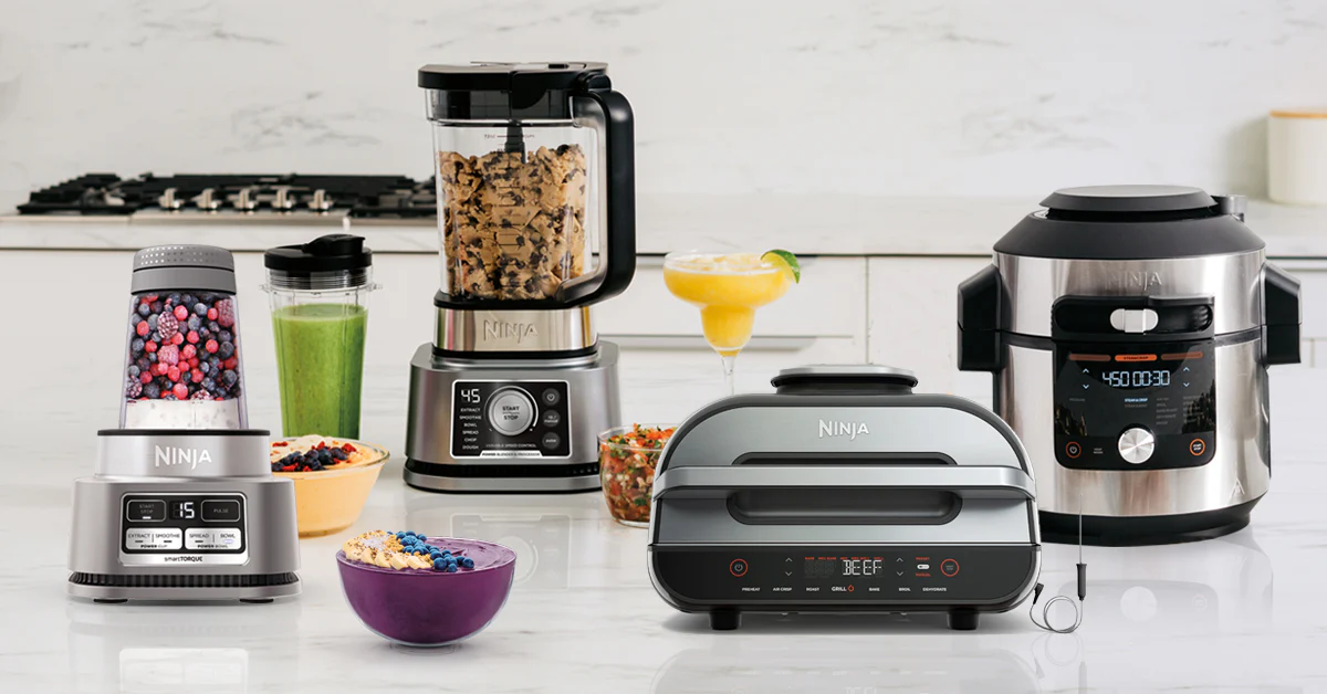 Ninja brand kitchen appliances, including a blender, air fryer, and coffee maker, displayed on a modern countertop.