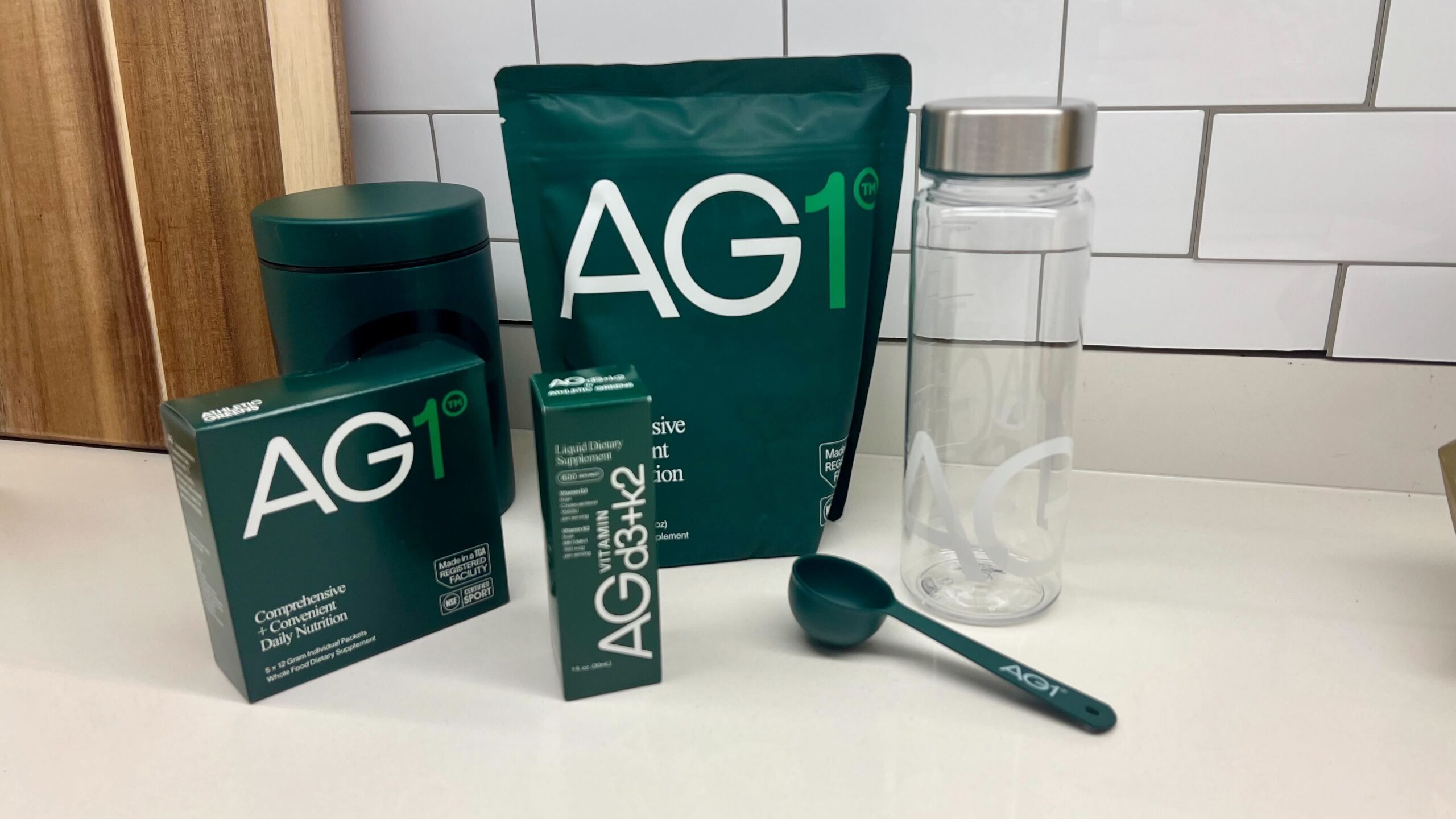 AG1 all-in-one nutritional supplement powder in a glass, offering a blend of vitamins, minerals, and superfoods.