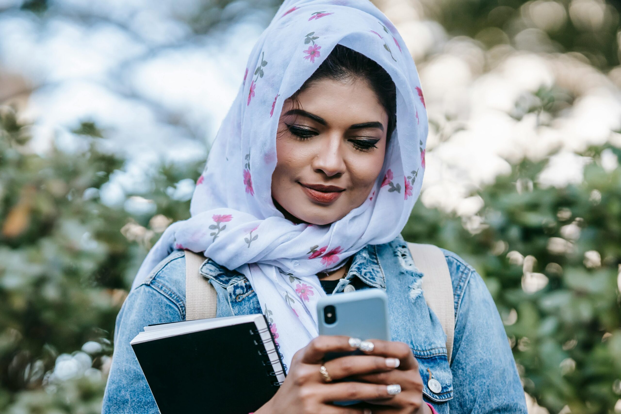 A person using social media on their smartphone, representing the influence of social media on modern culture.