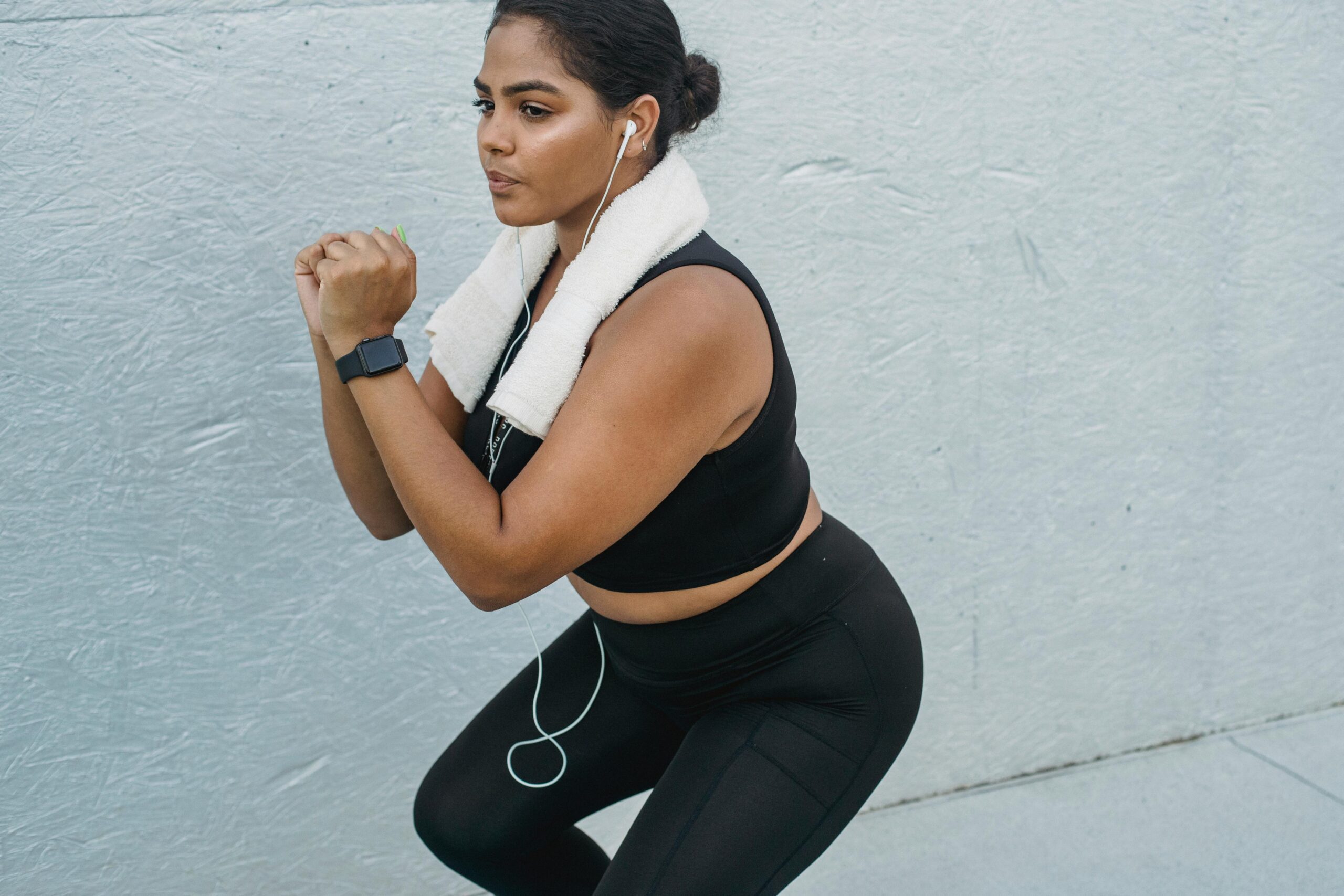 A person engaging in fitness and enjoying healthy nutrition for self-care.