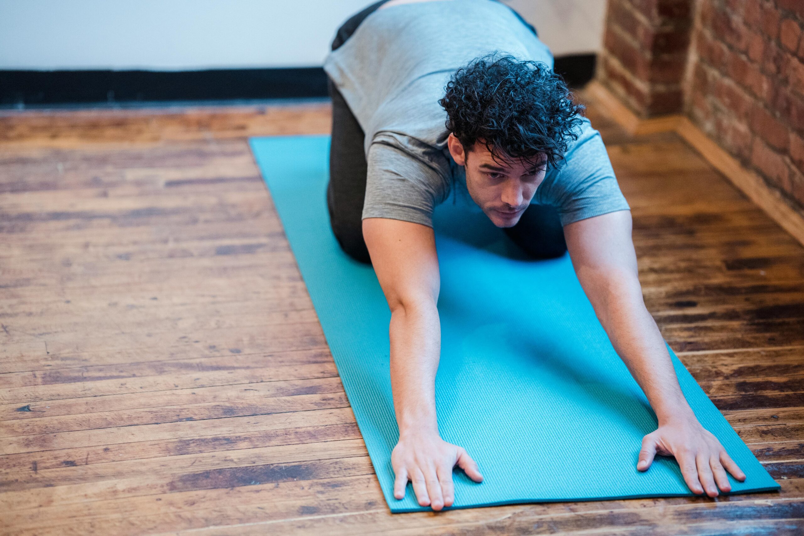 5 simple stretches to improve posture and wellness, including chest opener, cat-cow stretch, and upper back stretch.