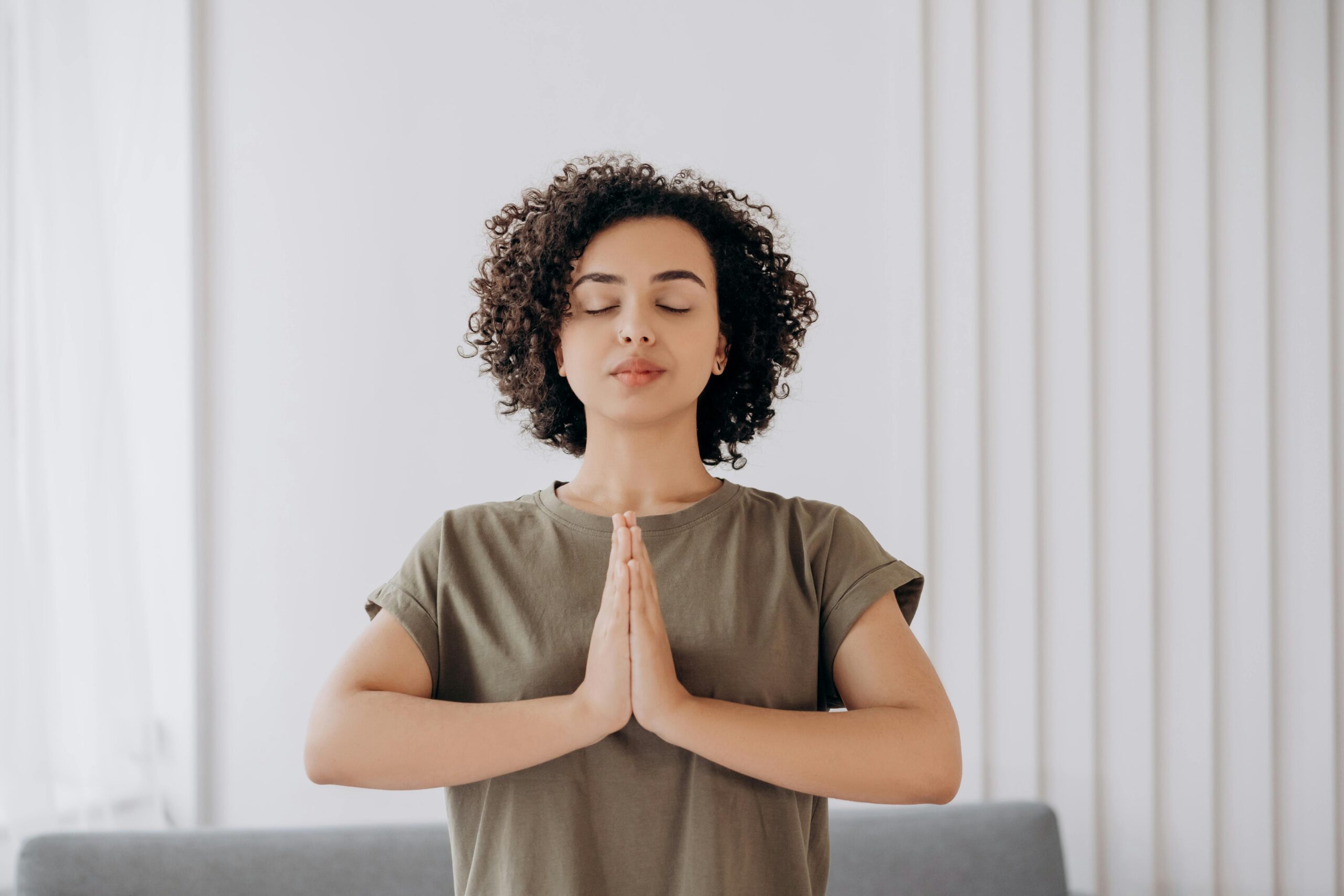 Person practicing self-care with meditation and relaxation