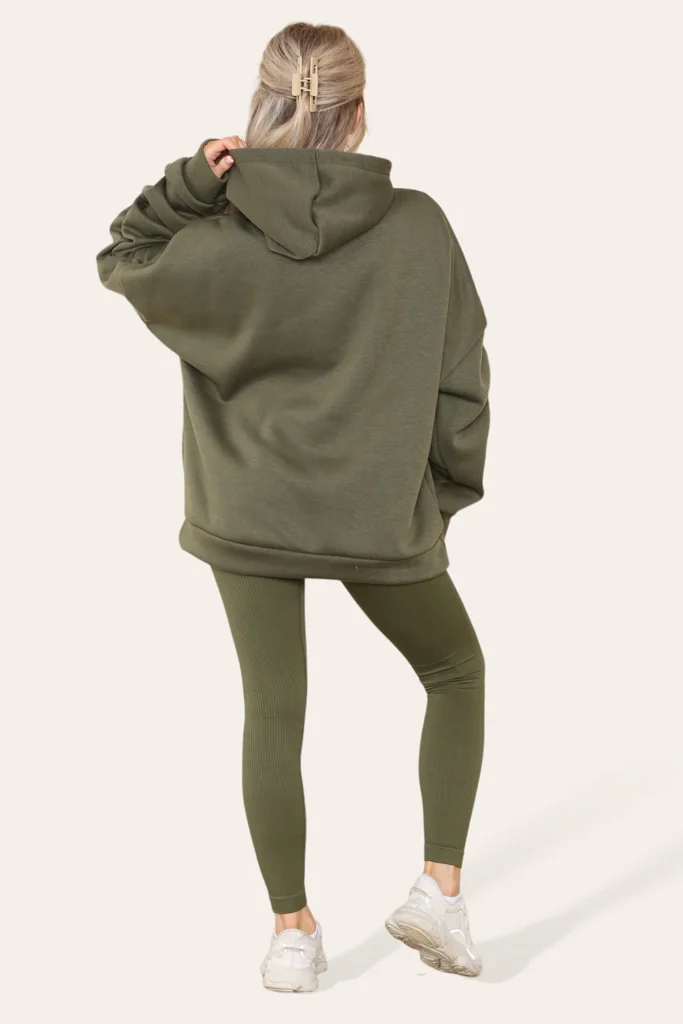 Trendy teen showcasing elevated athleisure with an oversized hoodie and fashion-forward accessories.