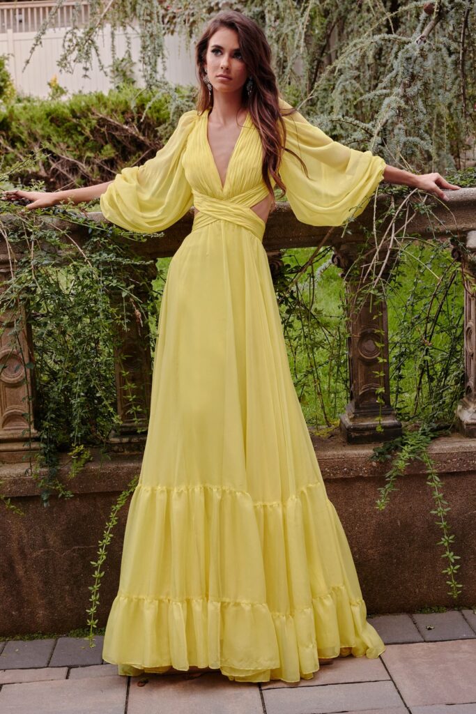 Model wearing a flowy vanilla yellow maxi dress with a delicate lace overlay, embodying relaxed spring elegance