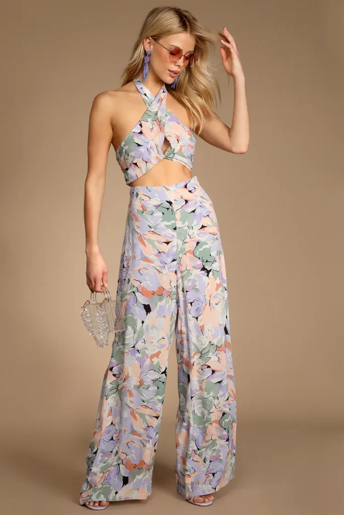 Stylishly dressed person wearing wide-leg pantaloons in a neutral tone paired with a fitted textural floral top, demonstrating playful yet refined spring fashion