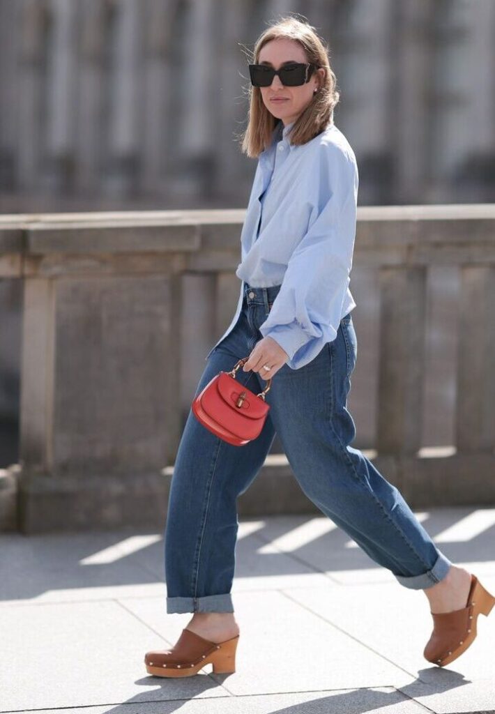 Close-up of a pair of chic woven clogs with intricate detailing, showcasing the popular spring 2025 footwear trend